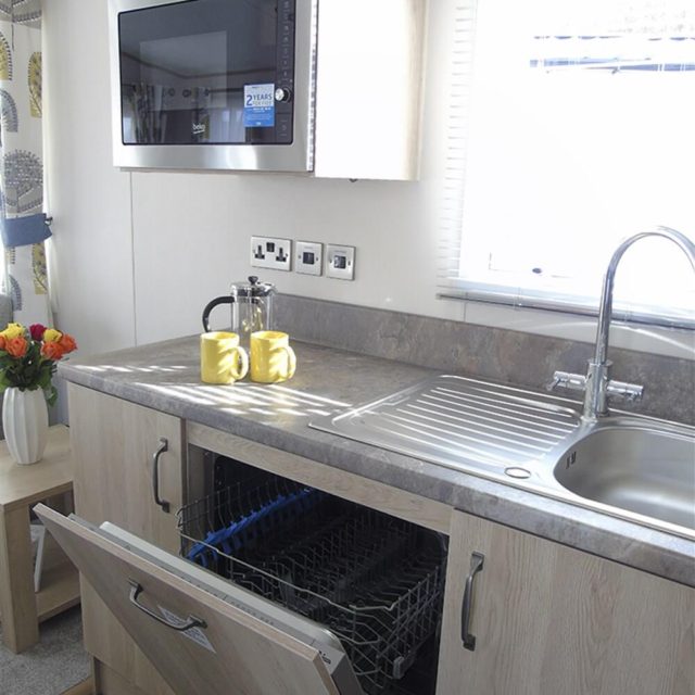 https://bulmerleisure.co.uk/wp-content/uploads/2020/05/1-402-1-18935-1-2020-ABI-Saffron-Static-Caravan-Holiday-Home-kitchen-dish-washer-detail-640x640.jpg