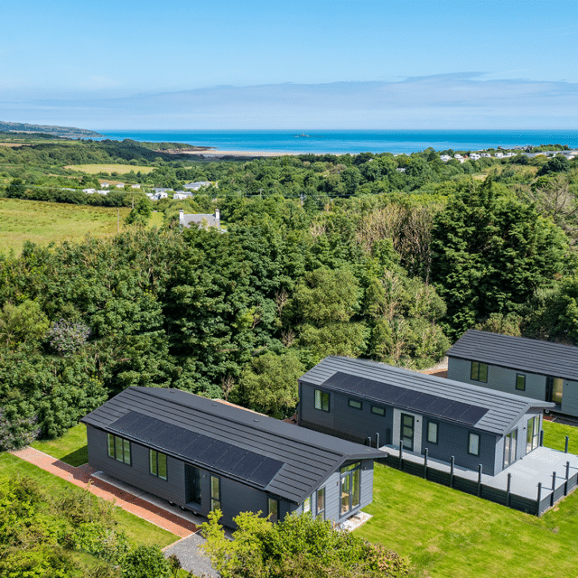 https://bulmerleisure.co.uk/wp-content/uploads/2021/07/DJI_0027-HDR-lodge-with-sea-640x640.png