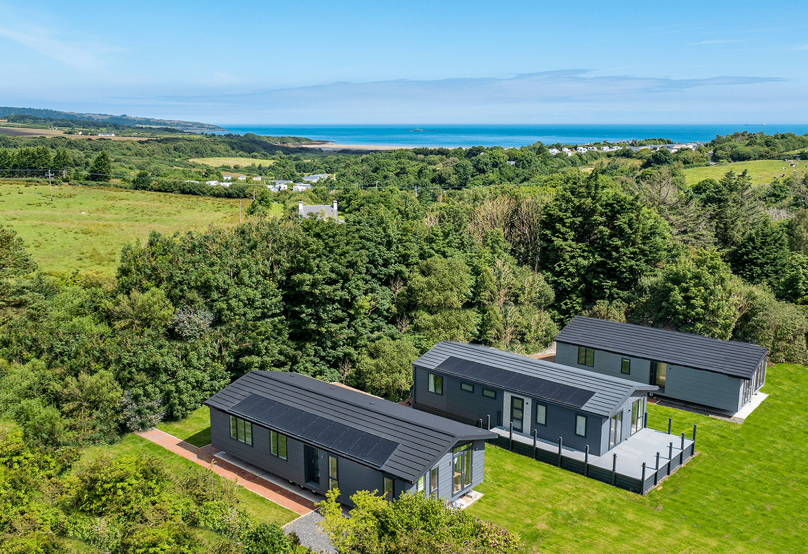 https://bulmerleisure.co.uk/wp-content/uploads/2021/07/DJI_0027-HDR-lodge-with-sea.png