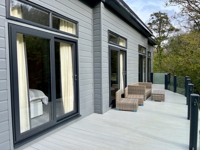 The decking of a a grey lodge