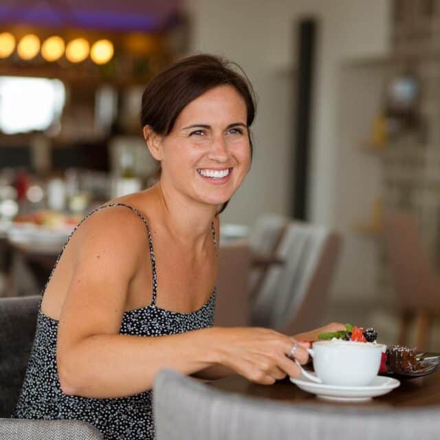 https://bulmerleisure.co.uk/wp-content/uploads/2022/12/silver-bay-holiday-village-anglesey-the-deck-house-woman-smiling-coffee-640x640.jpg